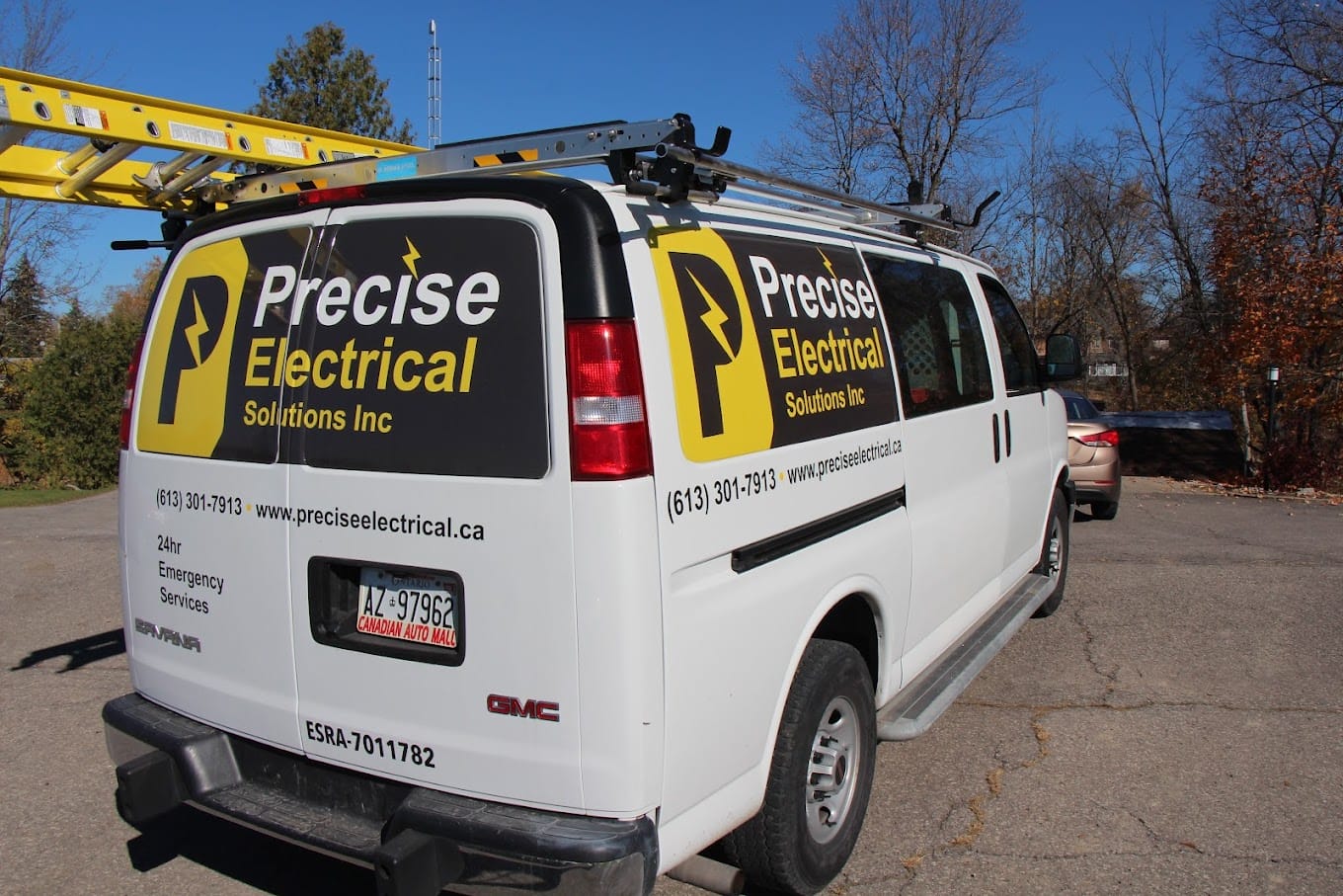 Precise Electrical Solutions van with contact information.