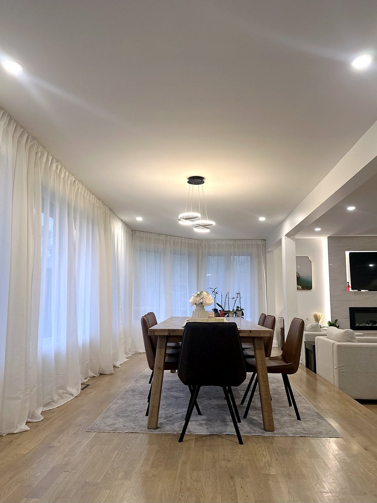 Dining room with LED pot lights and a modern ring pendant, installed by Precise Electrical in Ottawa
