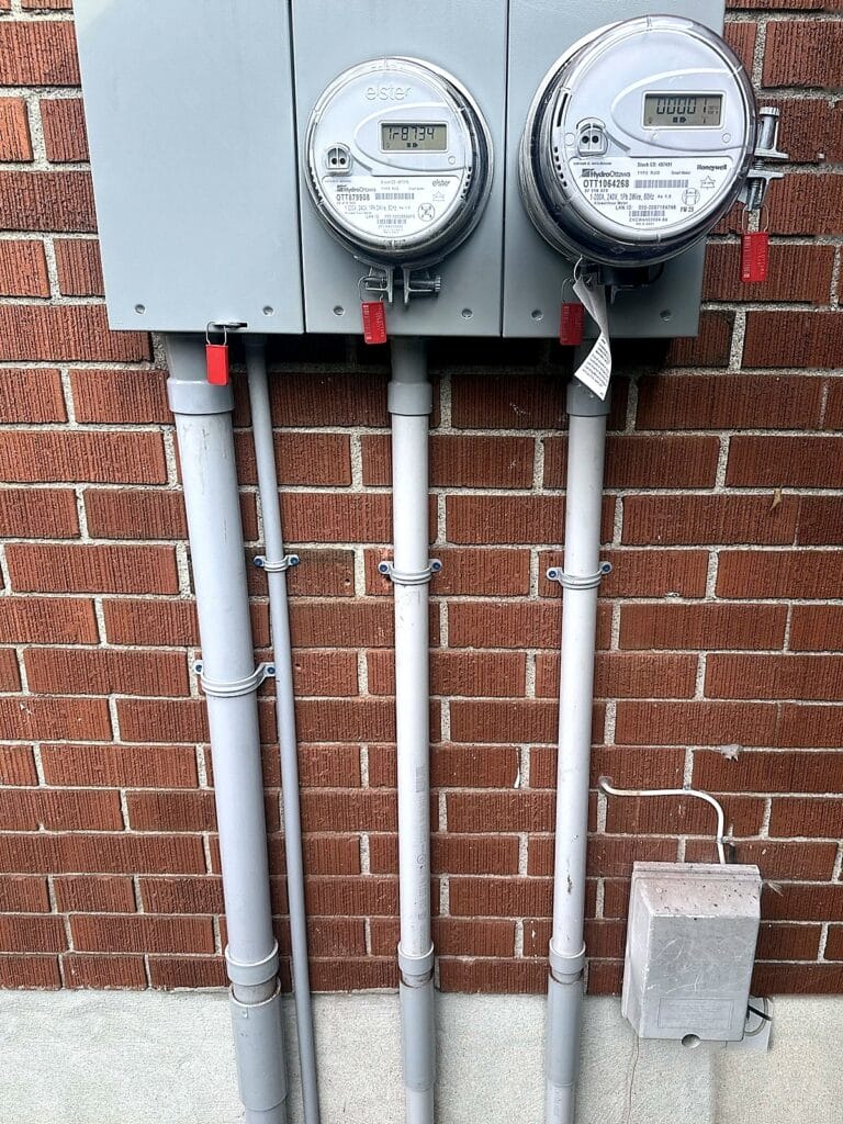 New double meter service on a brick wall